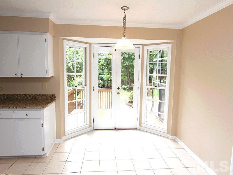 8333 Apple Orchard Way Raleigh, NC 27615 - Photo 12 of 25 a view of an empty room with a window