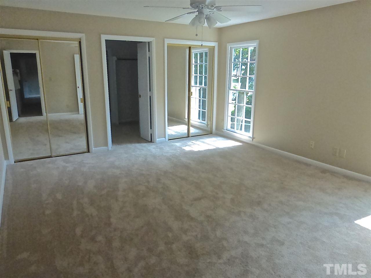 8333 Apple Orchard Way Raleigh, NC 27615 - Photo 19 of 25 an empty room with windows and closet