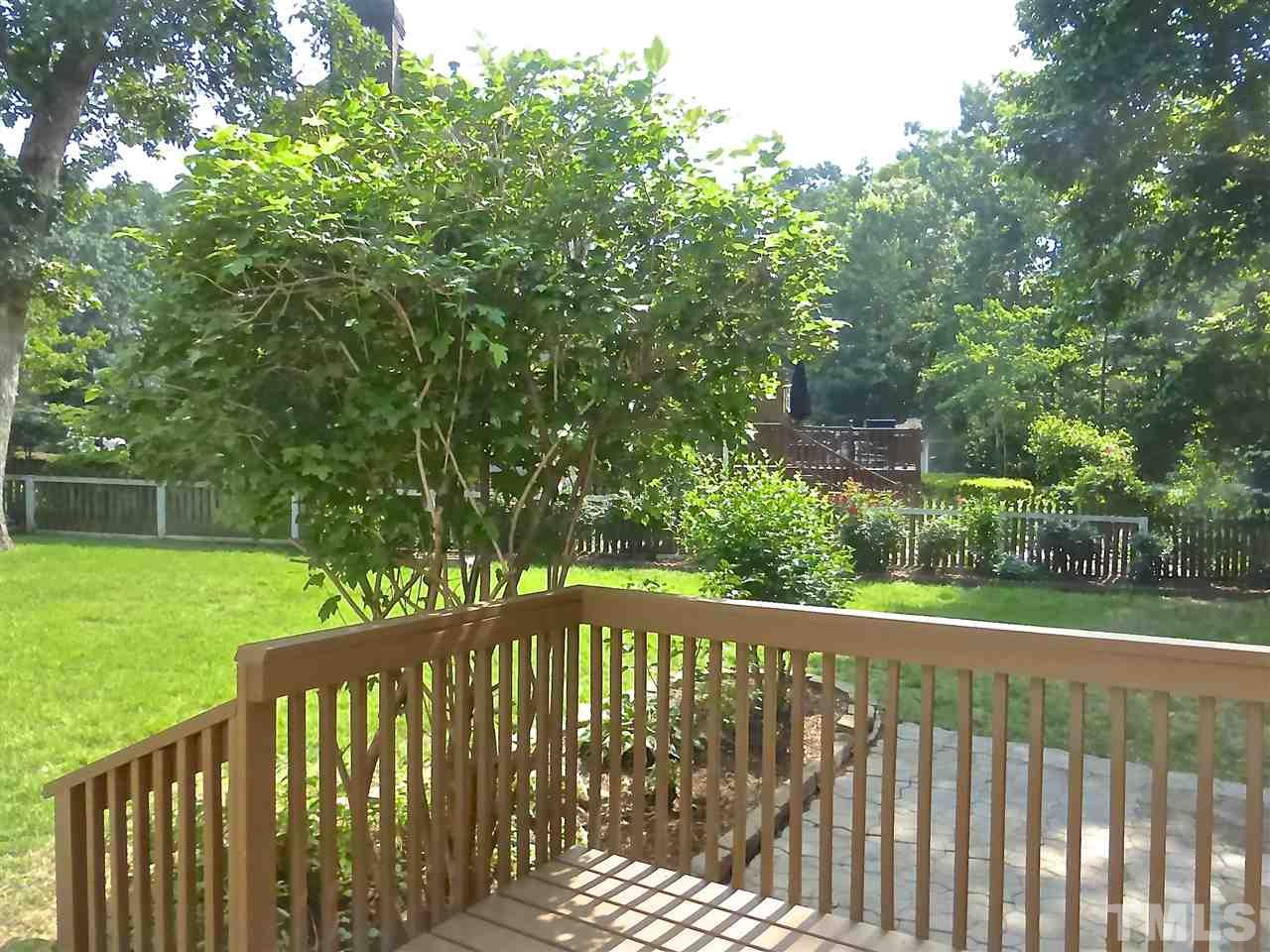 8333 Apple Orchard Way Raleigh, NC 27615 - Photo 21 of 25 a view of a wooden fence