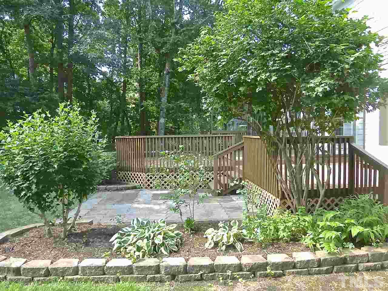 8333 Apple Orchard Way Raleigh, NC 27615 - Photo 23 of 25 a view of outdoor space with a garden