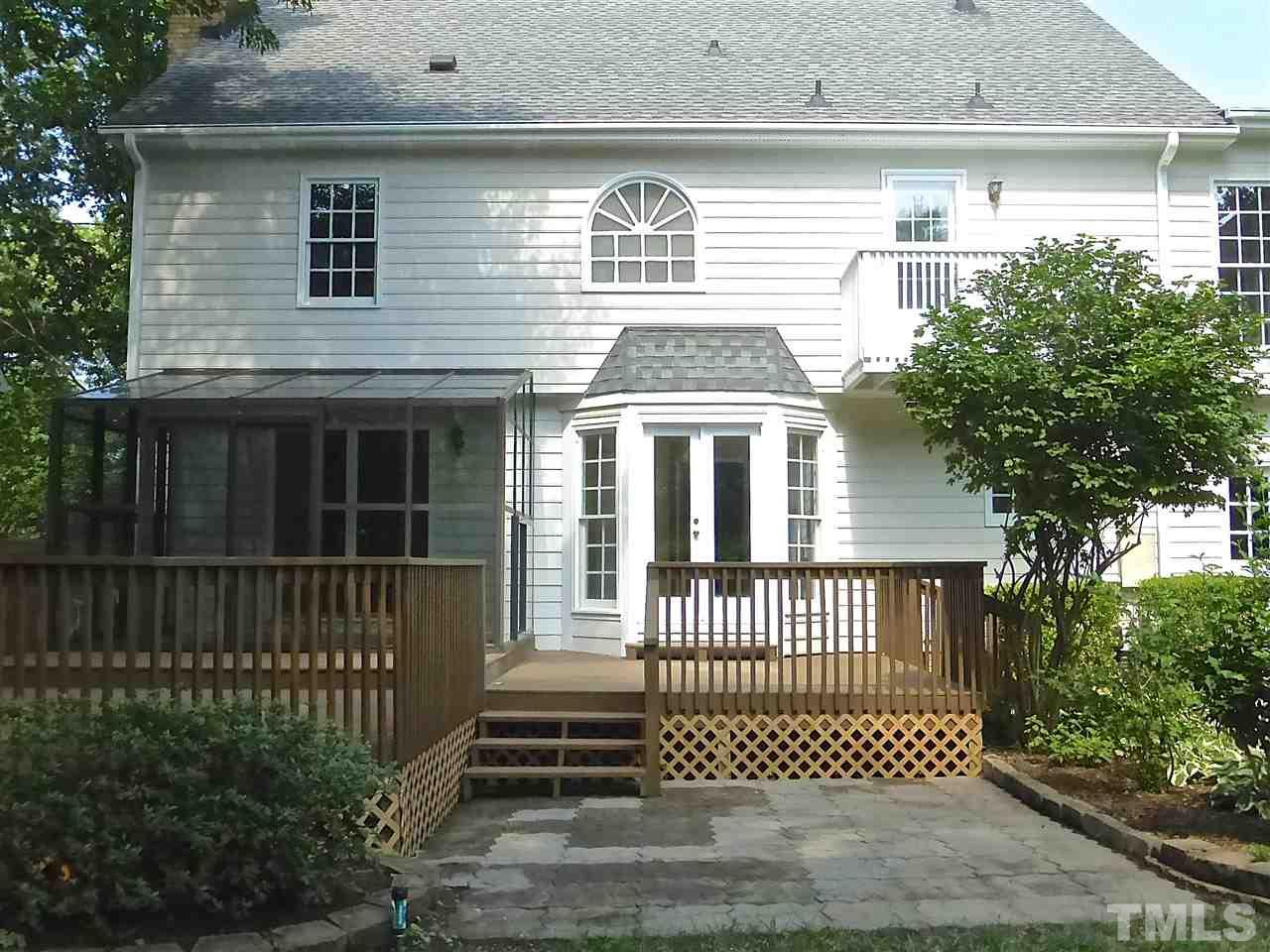 8333 Apple Orchard Way Raleigh, NC 27615 - Photo 25 of 25 a front view of a house with a garden