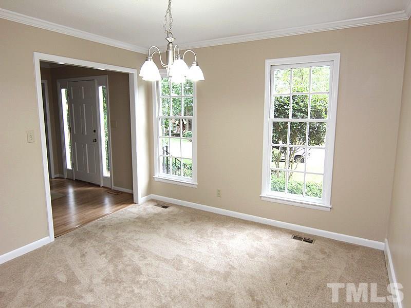 8333 Apple Orchard Way Raleigh, NC 27615 - Photo 7 of 25 a view of an empty room with a window