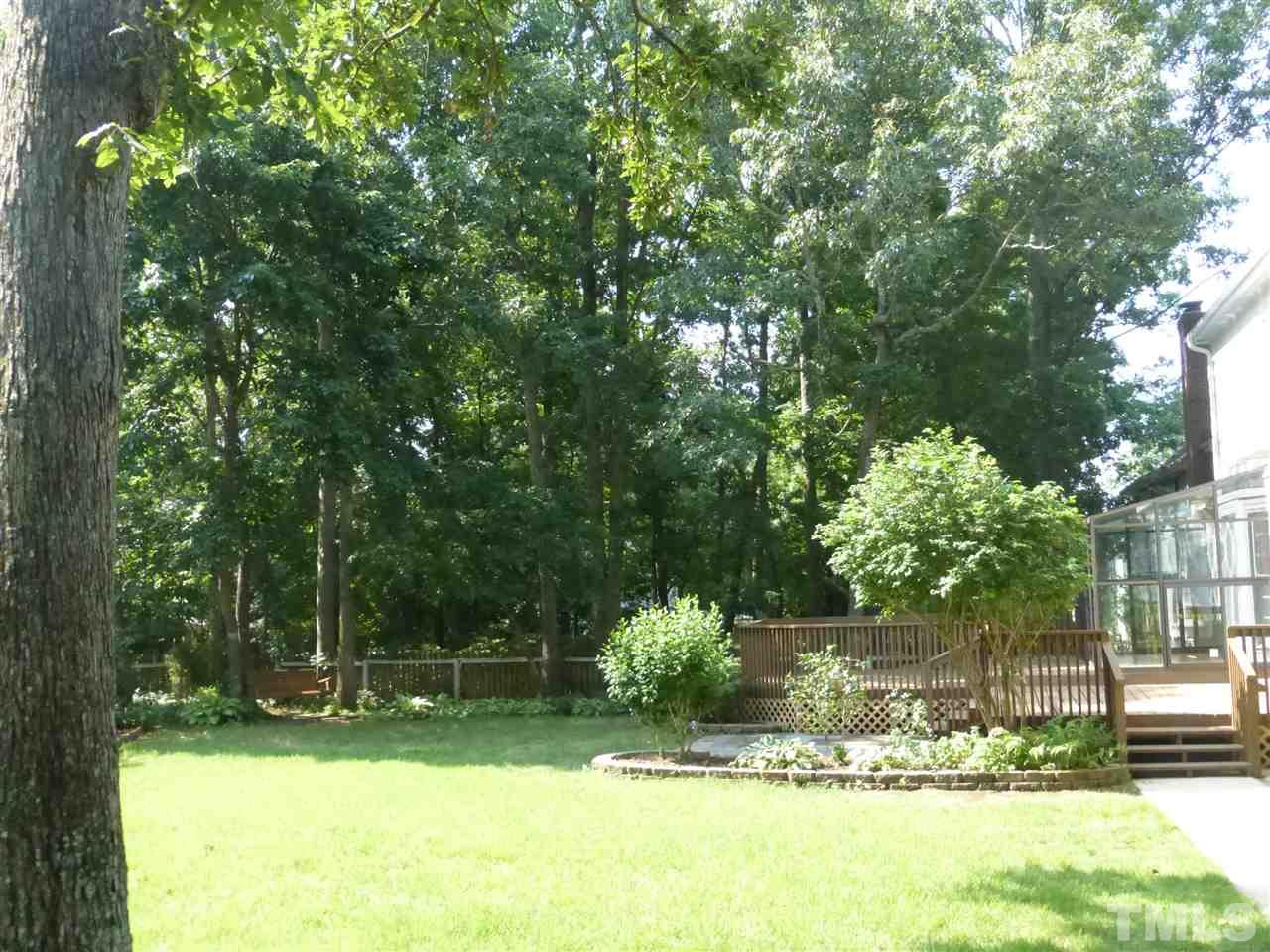 8333 Apple Orchard Way Raleigh, NC 27615 - Photo 8 of 25 a view of a backyard with a garden