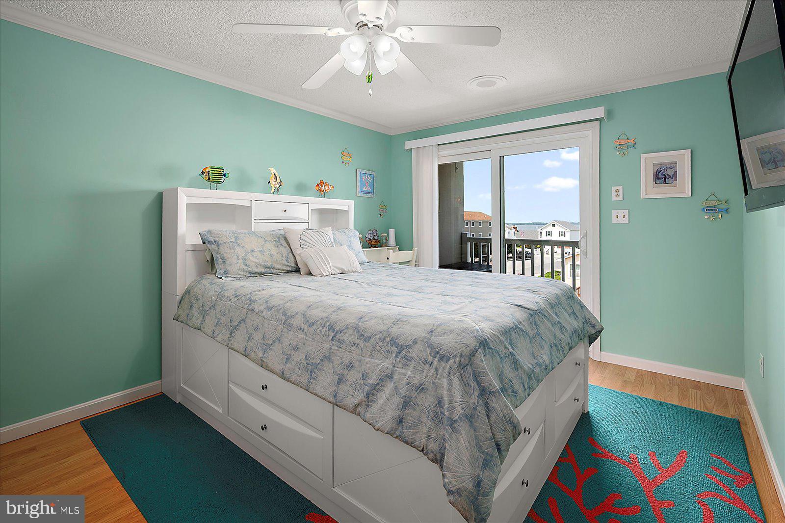 11603 Seaward Road, Unit 6 Ocean City, MD 21842 - Photo 15 of 43 a bed sitting in a bedroom next to a window