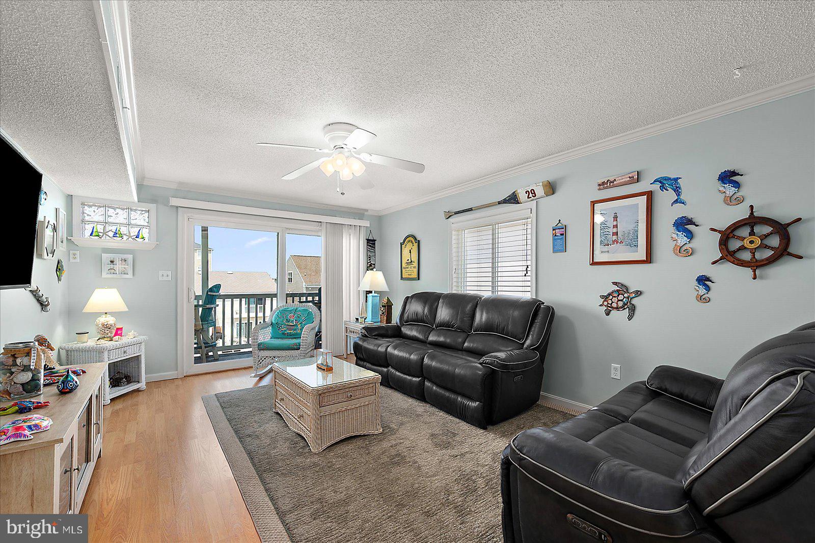 11603 Seaward Road, Unit 6 Ocean City, MD 21842 - Photo 2 of 43 a living room with furniture and a flat screen tv