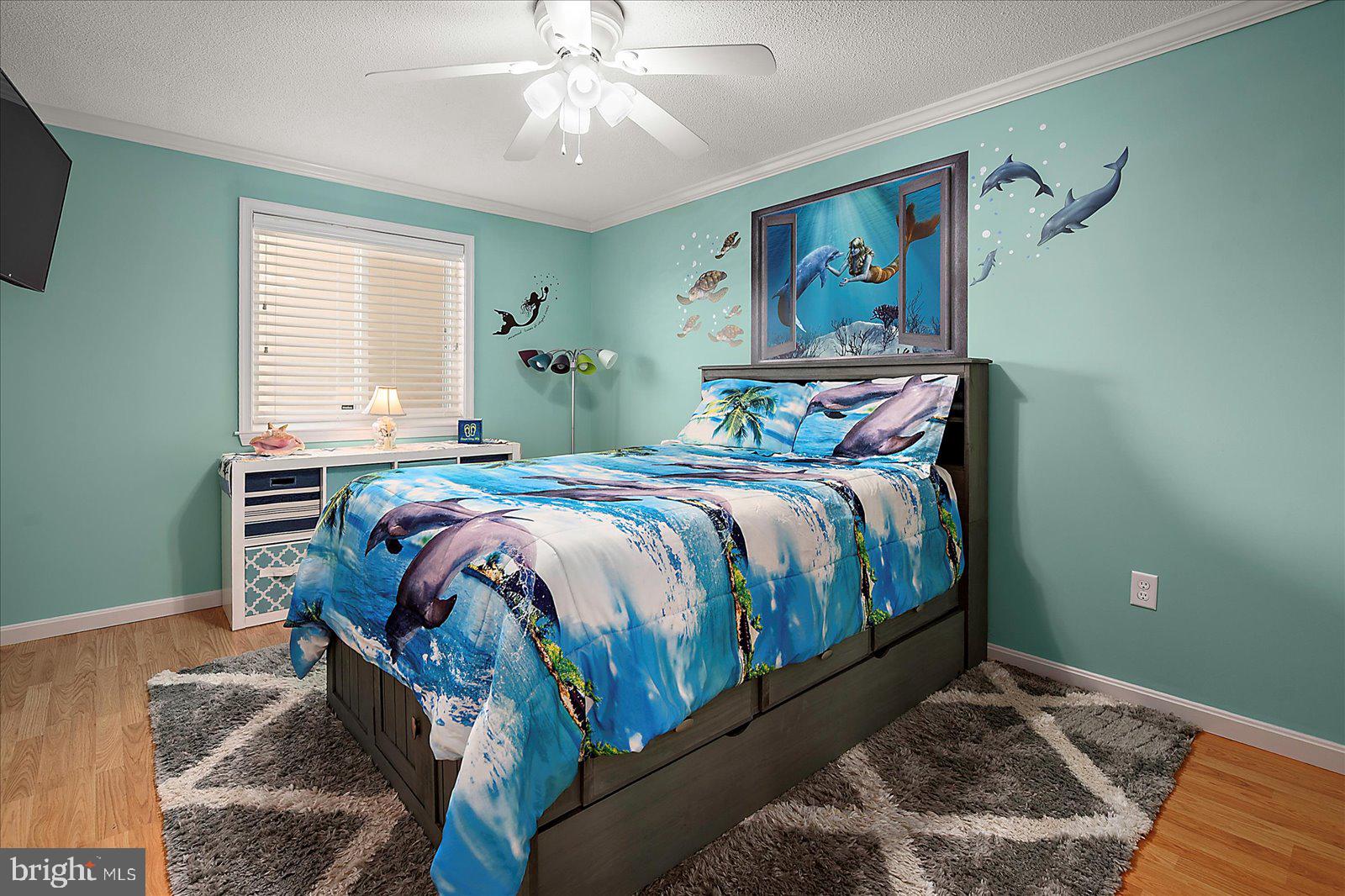 11603 Seaward Road, Unit 6 Ocean City, MD 21842 - Photo 21 of 43 a bed sitting in a bedroom next to a window