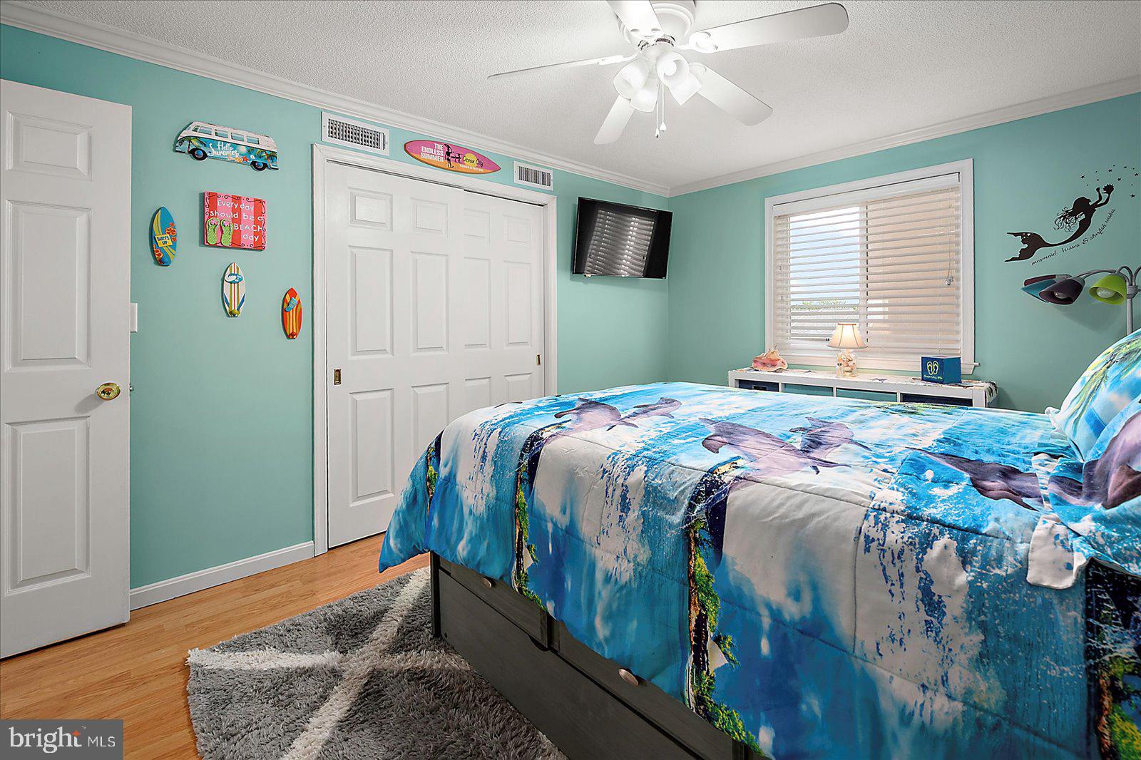 11603 Seaward Road, Unit 6 Ocean City, MD 21842 - Photo 22 of 43 a bedroom with a bed and a window
