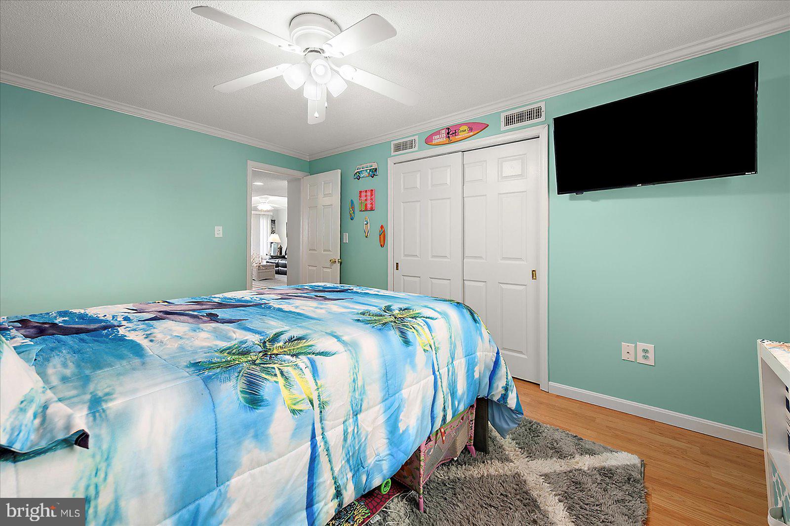 11603 Seaward Road, Unit 6 Ocean City, MD 21842 - Photo 23 of 43 a bedroom with a bed and a flat screen tv