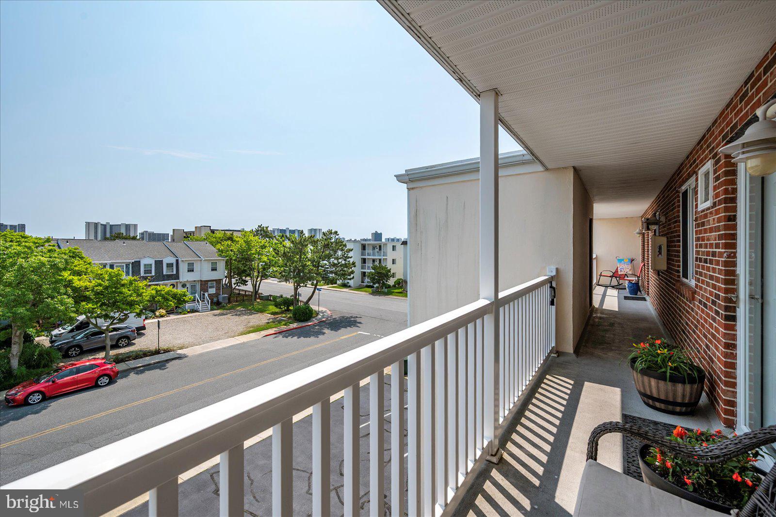 11603 Seaward Road, Unit 6 Ocean City, MD 21842 - Photo 32 of 43 a view of a balcony with potted plants