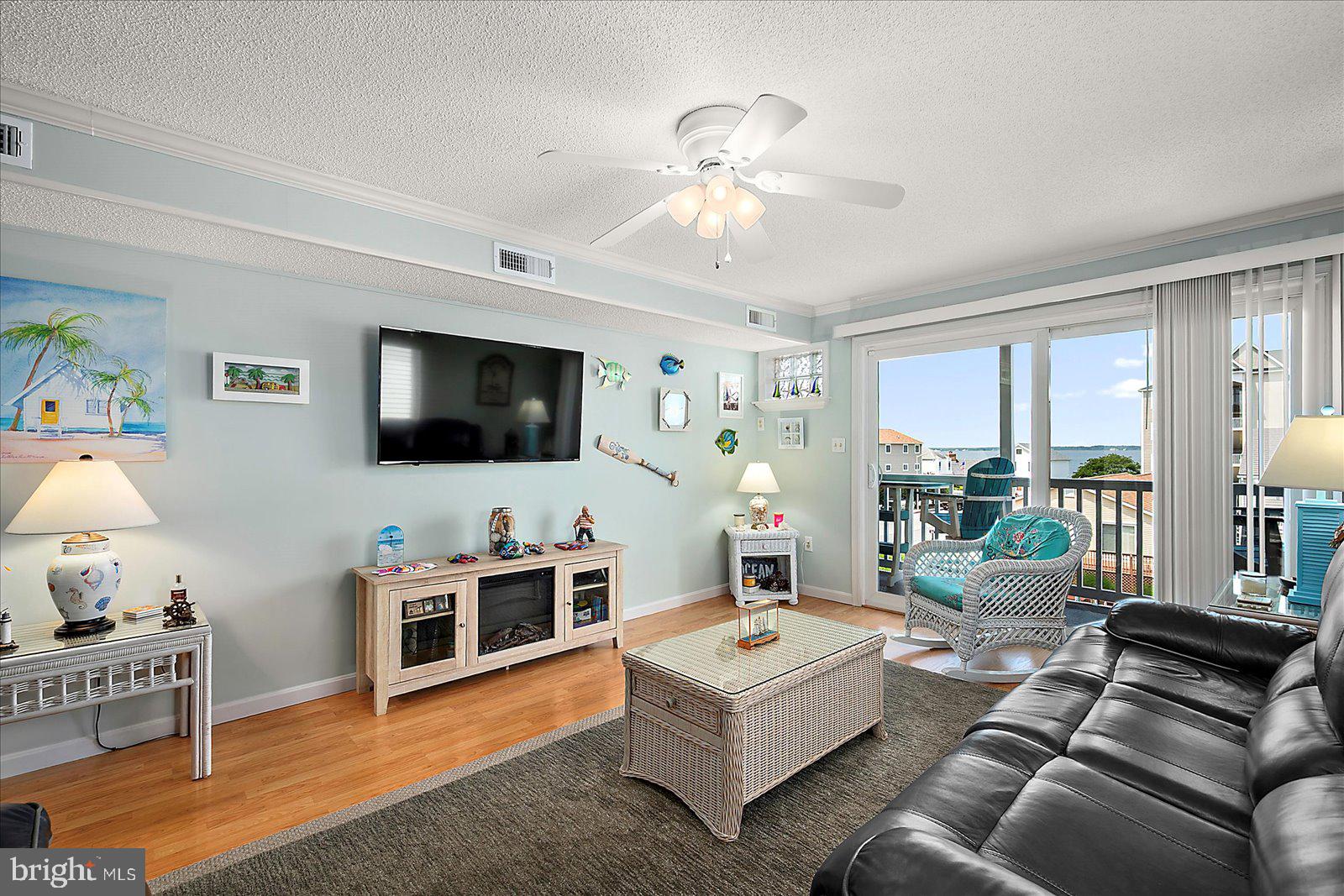 11603 Seaward Road, Unit 6 Ocean City, MD 21842 - Photo 4 of 43 a living room with furniture and a flat screen tv