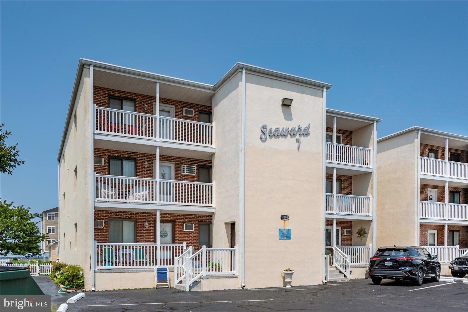 11603 Seaward Road, Unit 6 Ocean City, MD 21842 - Photo 42 of 43 a car parked in front of a building