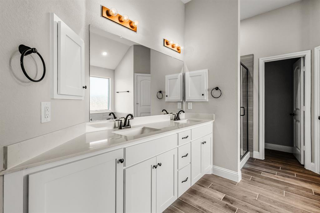 314 Pennington Road Josephine, TX 75173 - Photo 13 of 37 a spacious bathroom with a double vanity sink and a mirror
