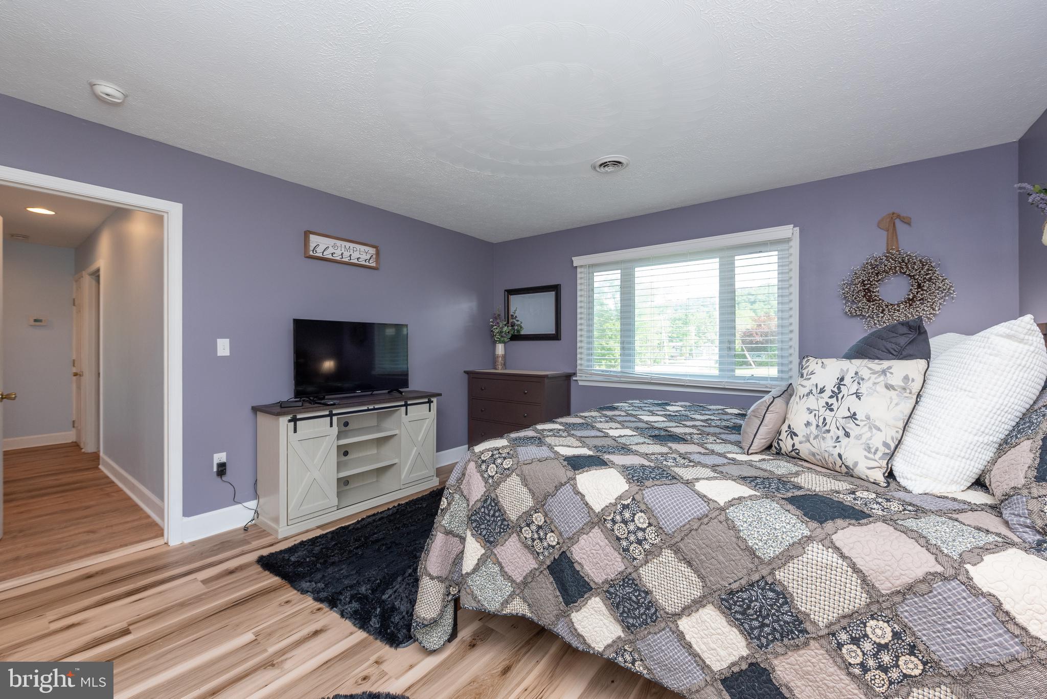 926 Marsh Hill Road McHenry, MD 21541 - Photo 28 of 70 a bedroom with a bed and a television