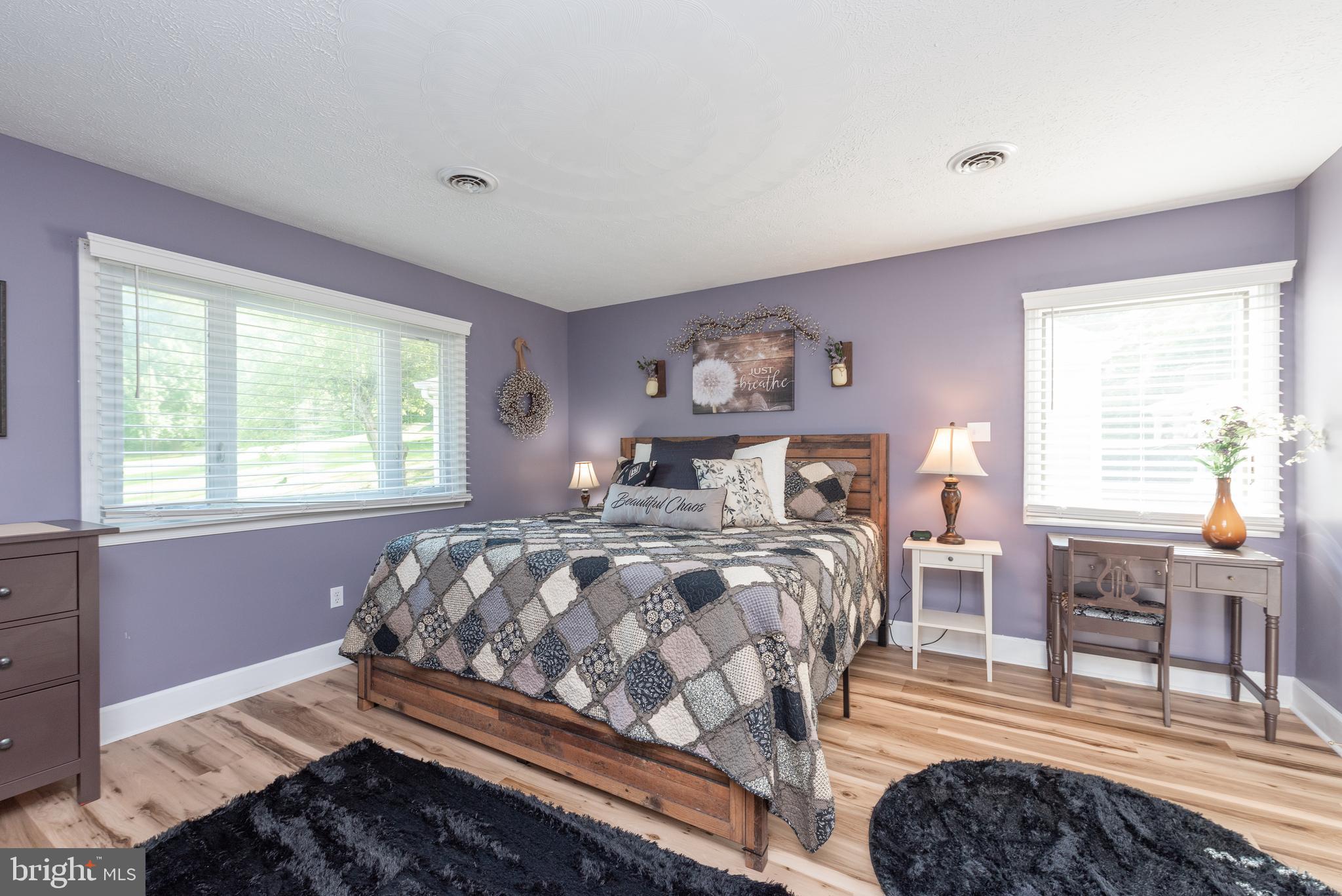 926 Marsh Hill Road McHenry, MD 21541 - Photo 29 of 70 a bedroom with a bed and wooden floor
