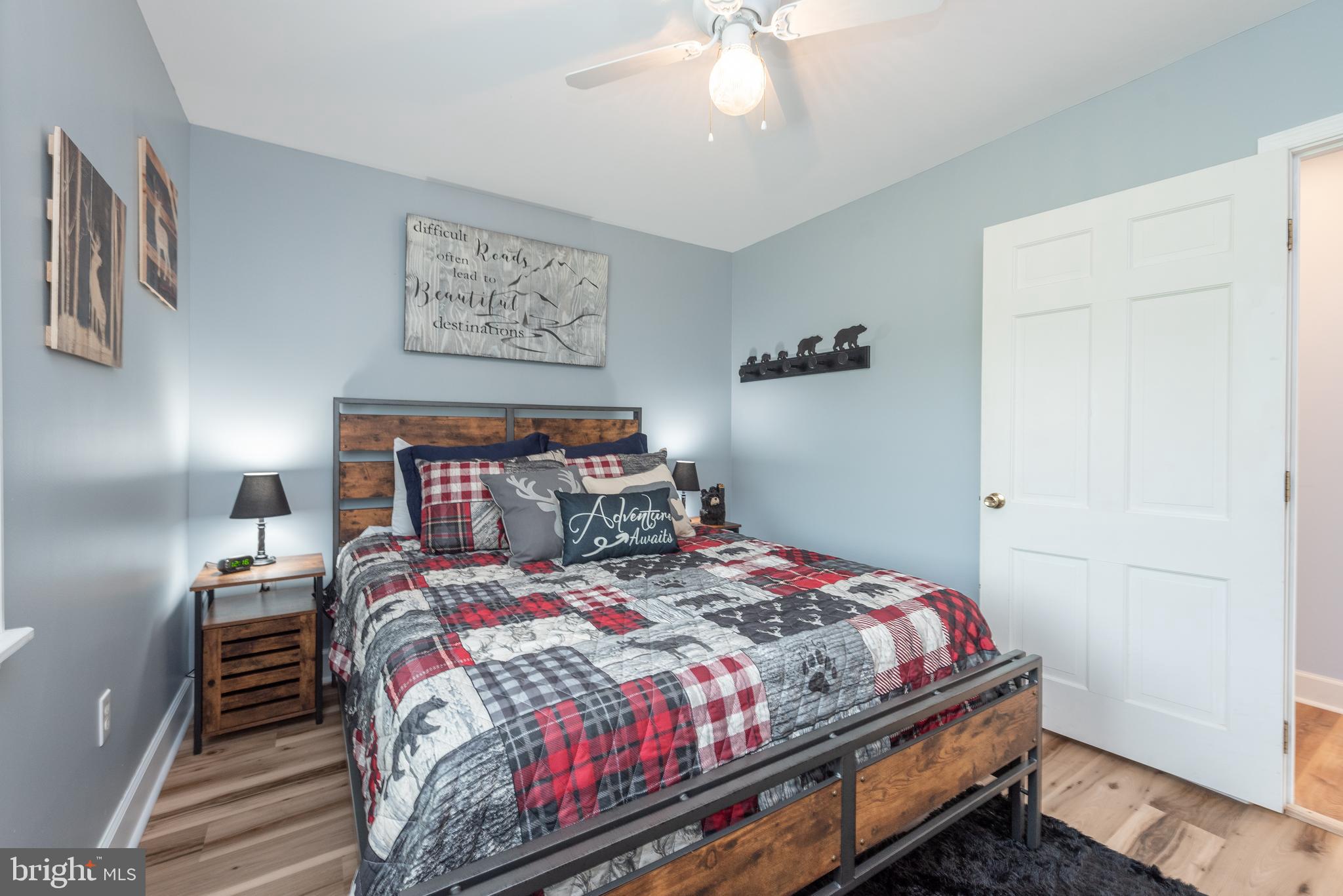 926 Marsh Hill Road McHenry, MD 21541 - Photo 32 of 70 a bedroom with a bed and a chandelier