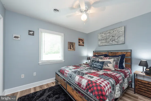 a bedroom with a bed and a television