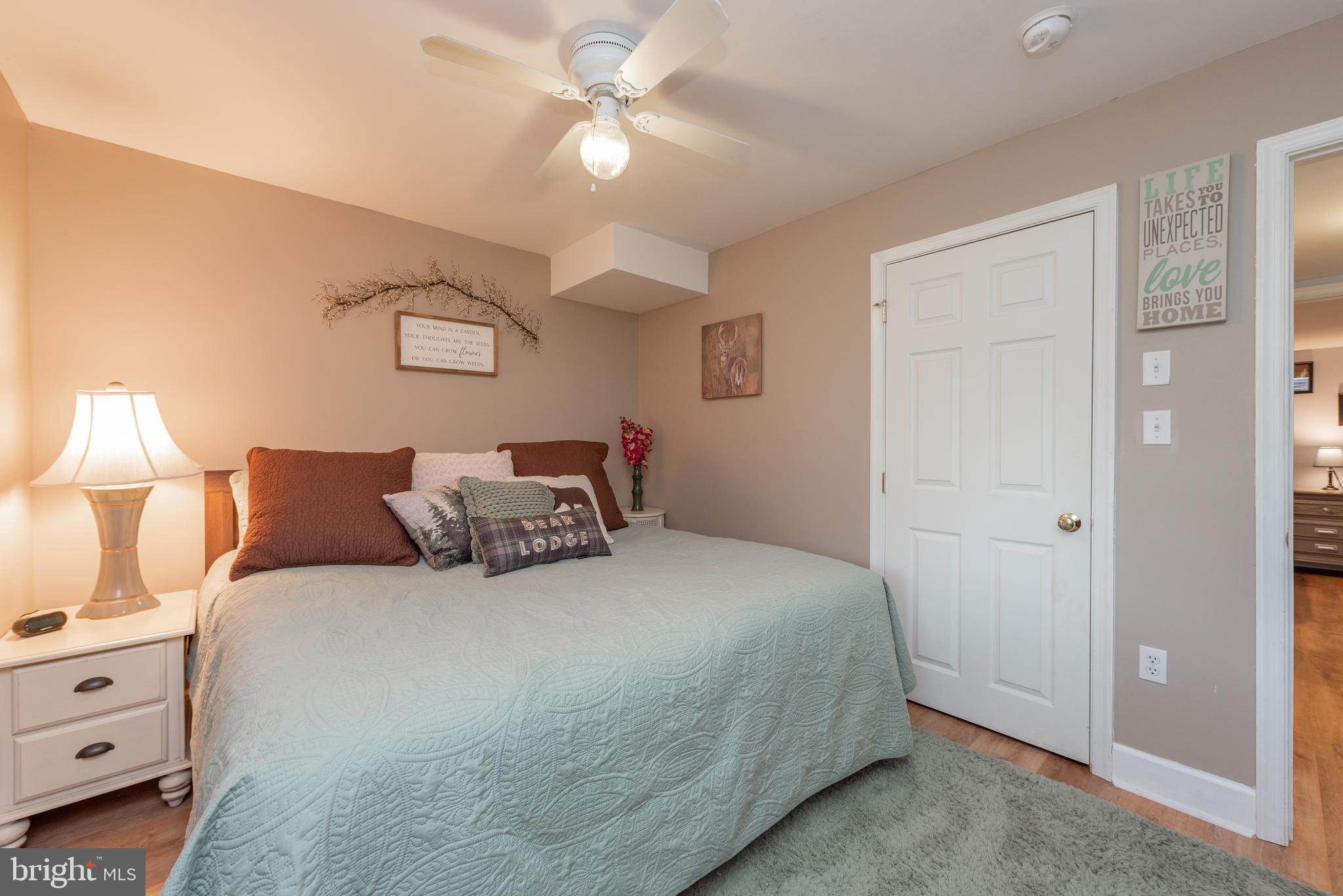 926 Marsh Hill Road McHenry, MD 21541 - Photo 44 of 70 a bedroom with a bed and a chandelier