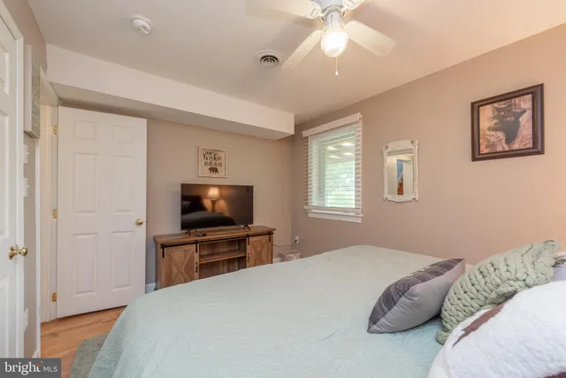 a view of a balcony with wooden floor and fence