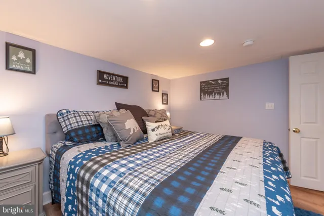 a front view of a house with a yard table and chairs