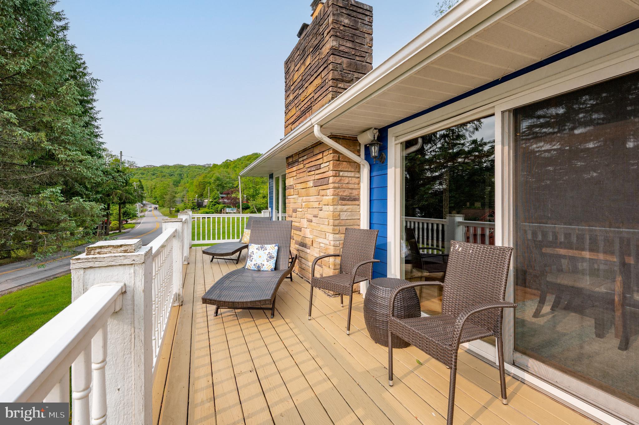 926 Marsh Hill Road McHenry, MD 21541 - Photo 59 of 70 a view of balcony with couch and chairs