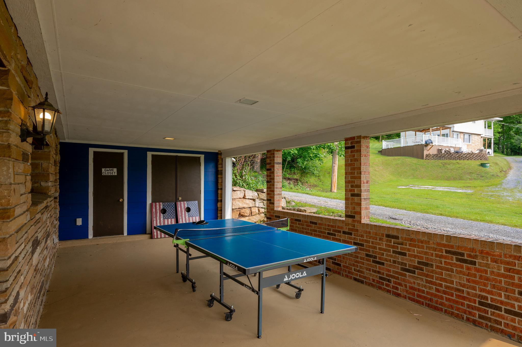 926 Marsh Hill Road McHenry, MD 21541 - Photo 64 of 70 a view of a patio with a table chairs and a swimming pool