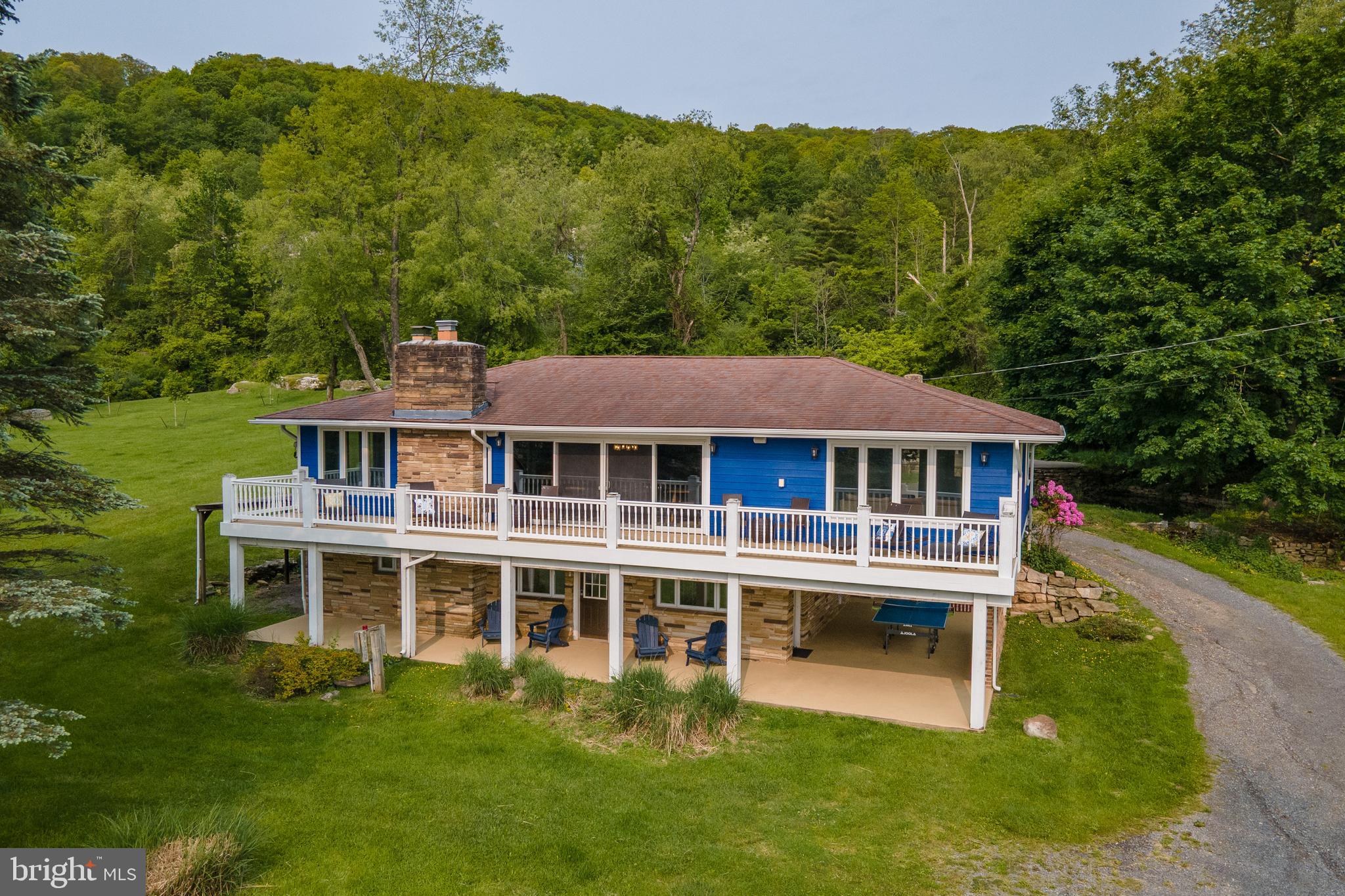 926 Marsh Hill Road McHenry, MD 21541 - Photo 68 of 70 a front view of a house with a yard table and chairs