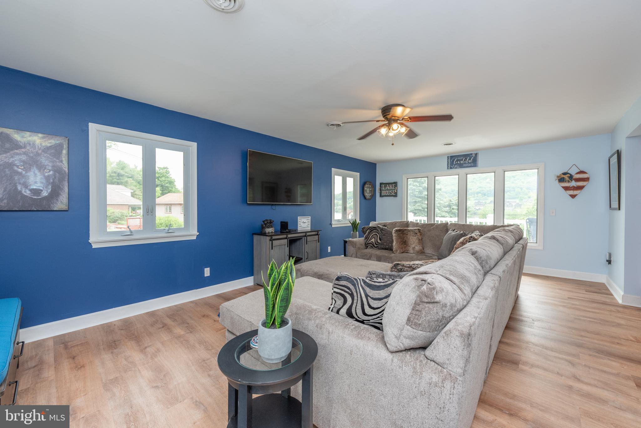 926 Marsh Hill Road McHenry, MD 21541 - Photo 9 of 70 a living room with furniture a flat screen tv and a window
