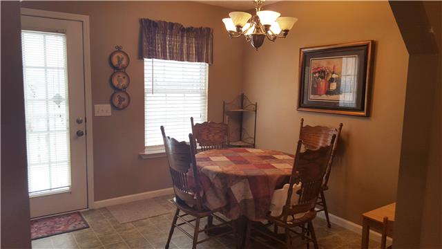 510 North Harris Road Portland, TN 37148 - Photo 4 of 11 a view of a dining room with furniture and chandelier