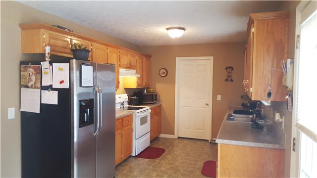 510 North Harris Road Portland, TN 37148 - Photo 5 of 11 a kitchen with stainless steel appliances granite countertop a refrigerator and a sink
