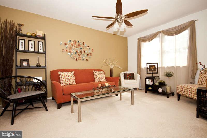 7758 Telegraph Road Severn, MD 21144 - Photo 3 of 29 a living room with furniture and a large window