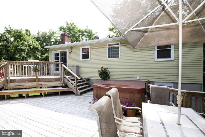 7758 Telegraph Road Severn, MD 21144 - Photo 23 of 29 a view of a patio with a table and chairs