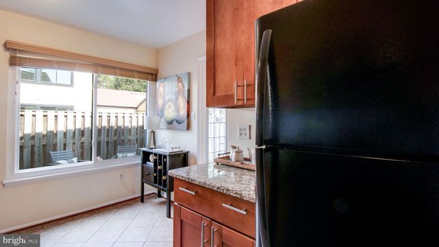 a kitchen with refrigerator and window