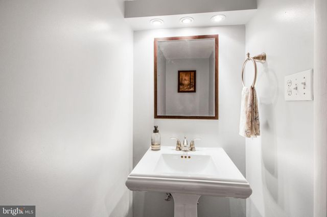 a bathroom with a sink and mirror