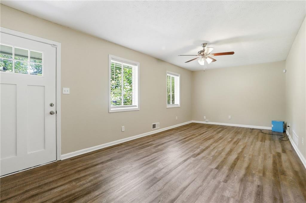 4505 Wonder Valley Trail Decatur, GA 30034 - Photo 4 of 34 a view of empty room with wooden floor and fan