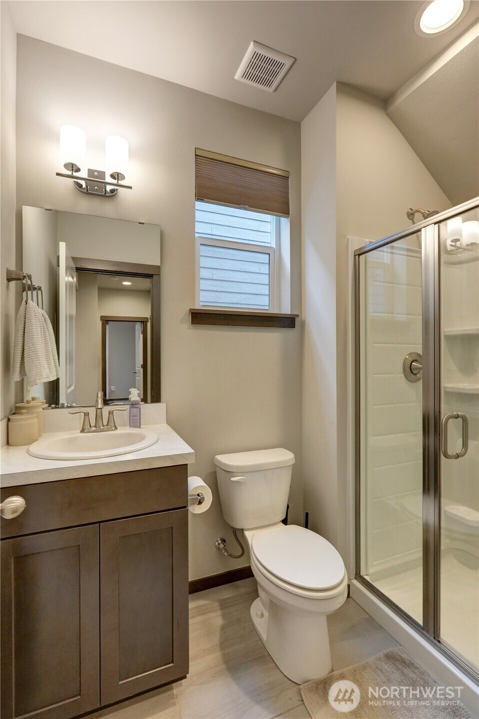 5154 Granger Street Bremerton, WA 98312 - Photo 13 of 26 a bathroom with a toilet a sink and mirror