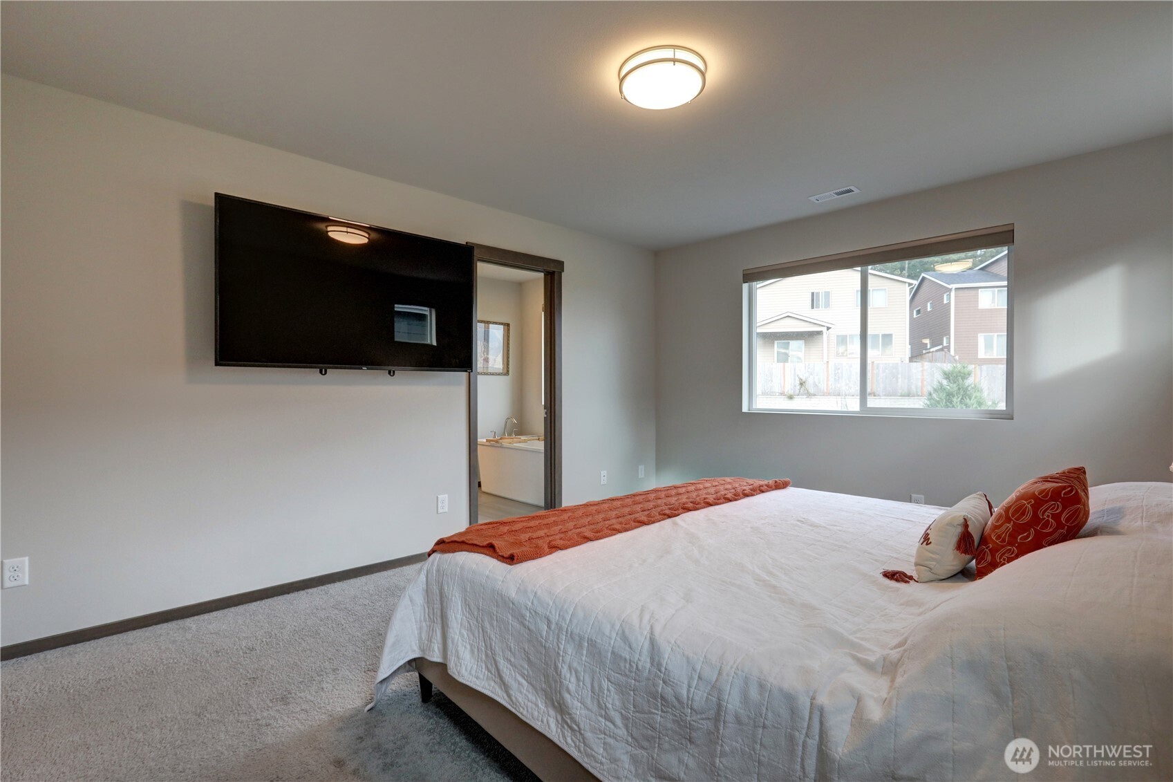 5154 Granger Street Bremerton, WA 98312 - Photo 15 of 26 a bedroom with a bed and a flat screen tv