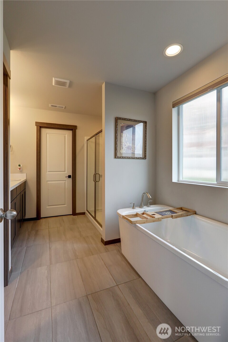 5154 Granger Street Bremerton, WA 98312 - Photo 17 of 26 a spacious bathroom with a granite countertop tub shower and a sink