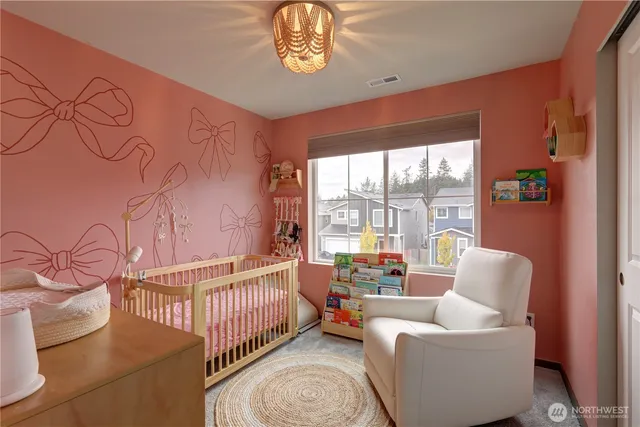 a balcony with furniture and a large window