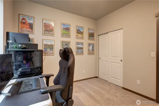 a view of workspace with furniture and windows