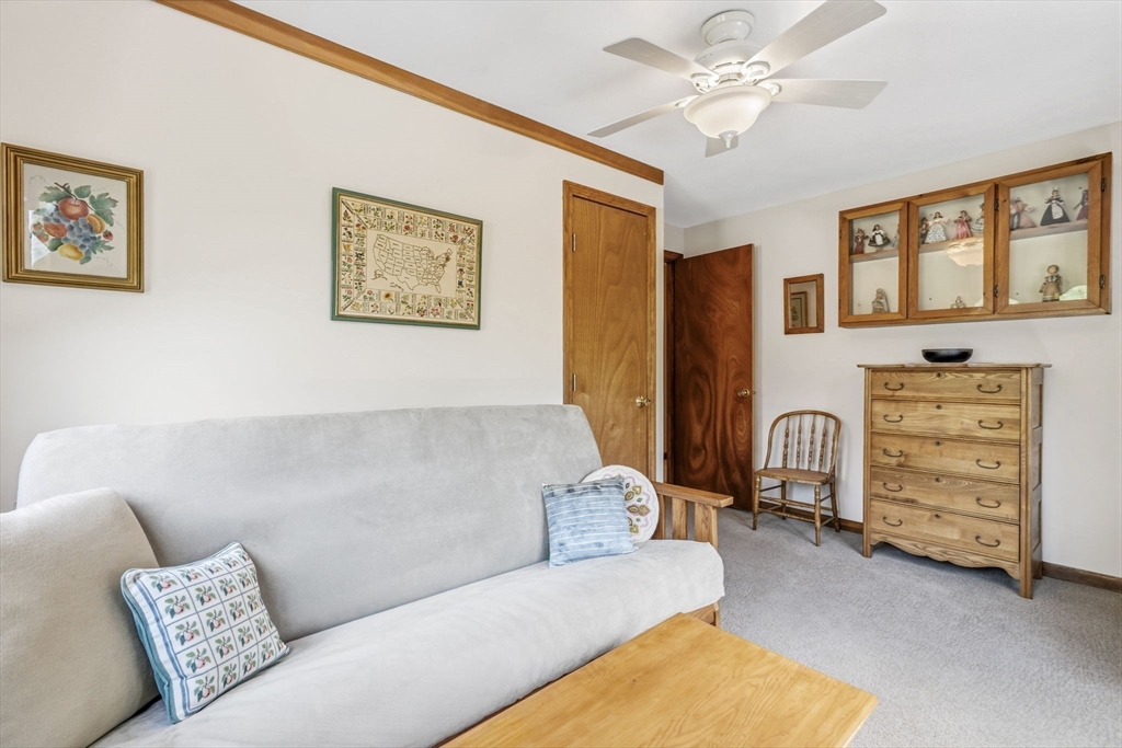 788 Burts Pit Road Northampton, MA 01062 - Photo 25 of 42 a living room with furniture and a dresser