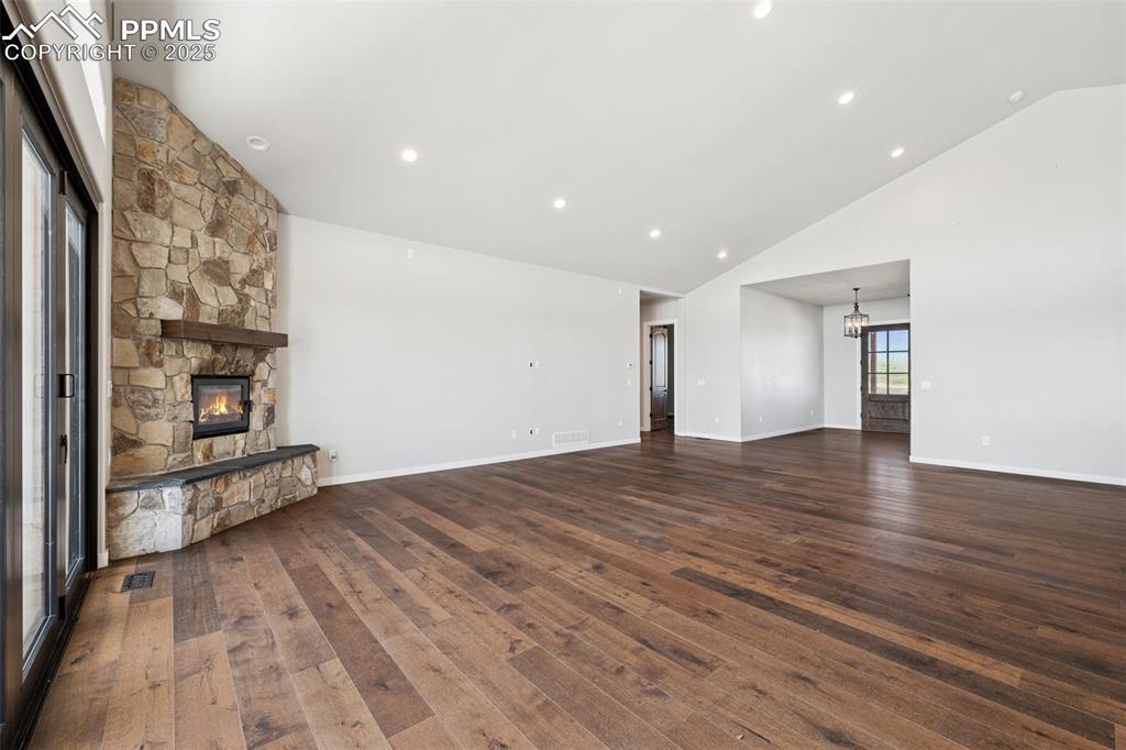 24365 Murphy Road Calhan, CO 80808 - Photo 11 of 48 an empty room with wooden floor and windows