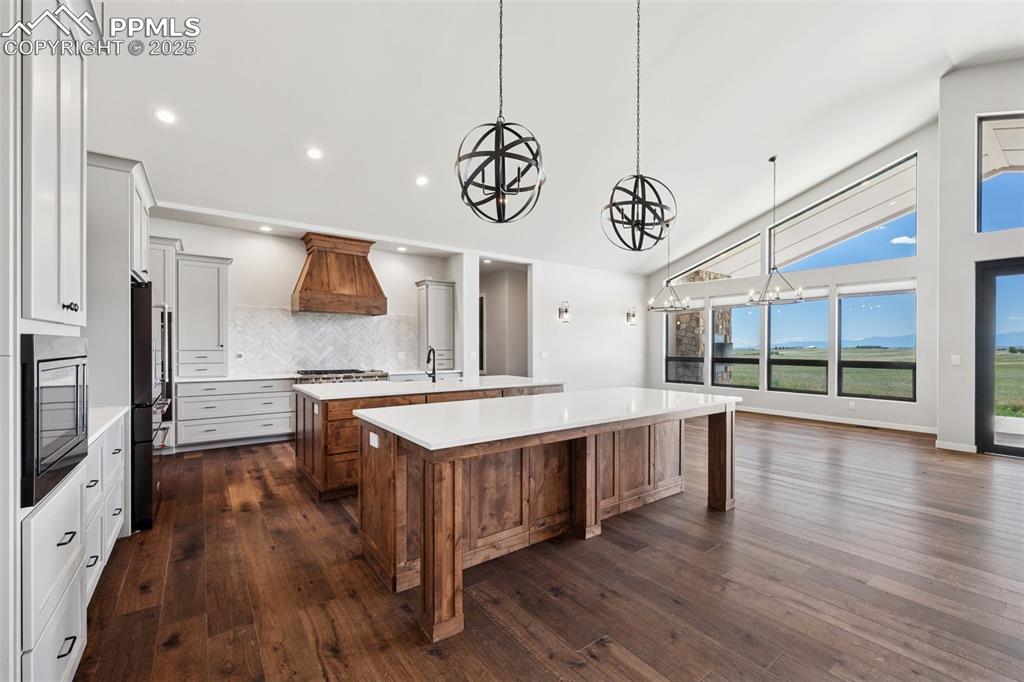 24365 Murphy Road Calhan, CO 80808 - Photo 12 of 48 a large kitchen with kitchen island a large island in the center