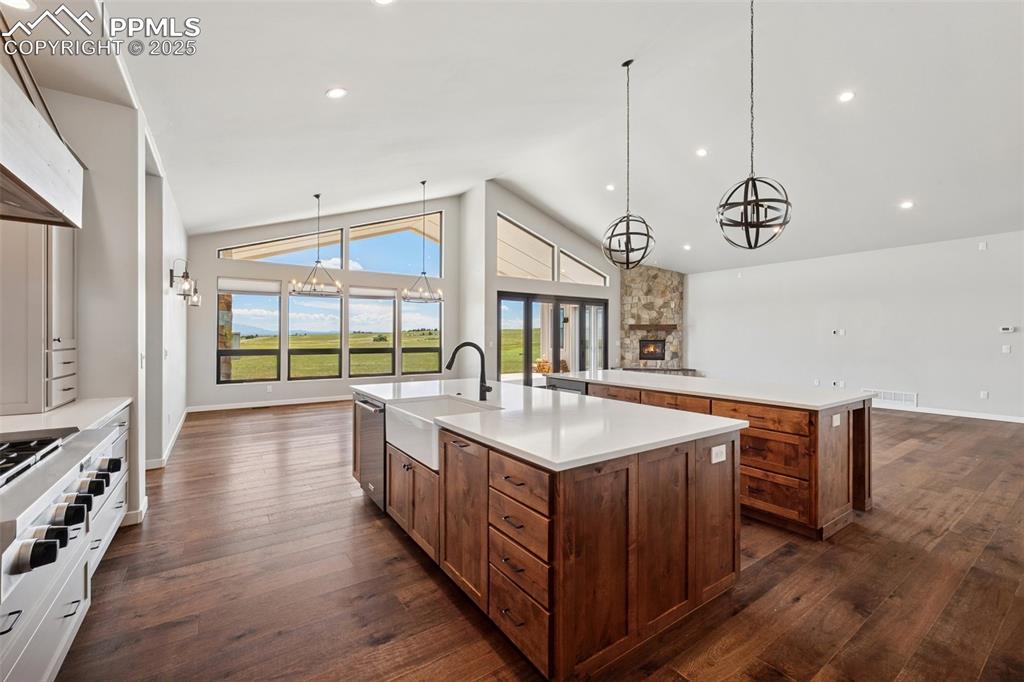 24365 Murphy Road Calhan, CO 80808 - Photo 15 of 48 a kitchen with a sink and wooden floor