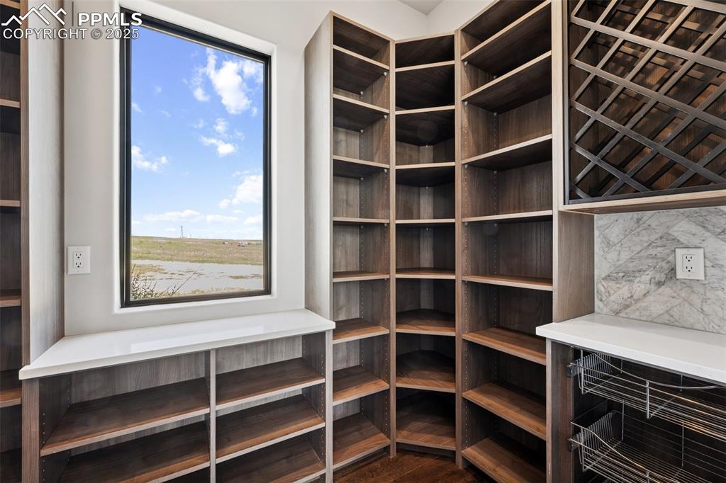 24365 Murphy Road Calhan, CO 80808 - Photo 20 of 48 a view of an empty room with wooden floor and a window