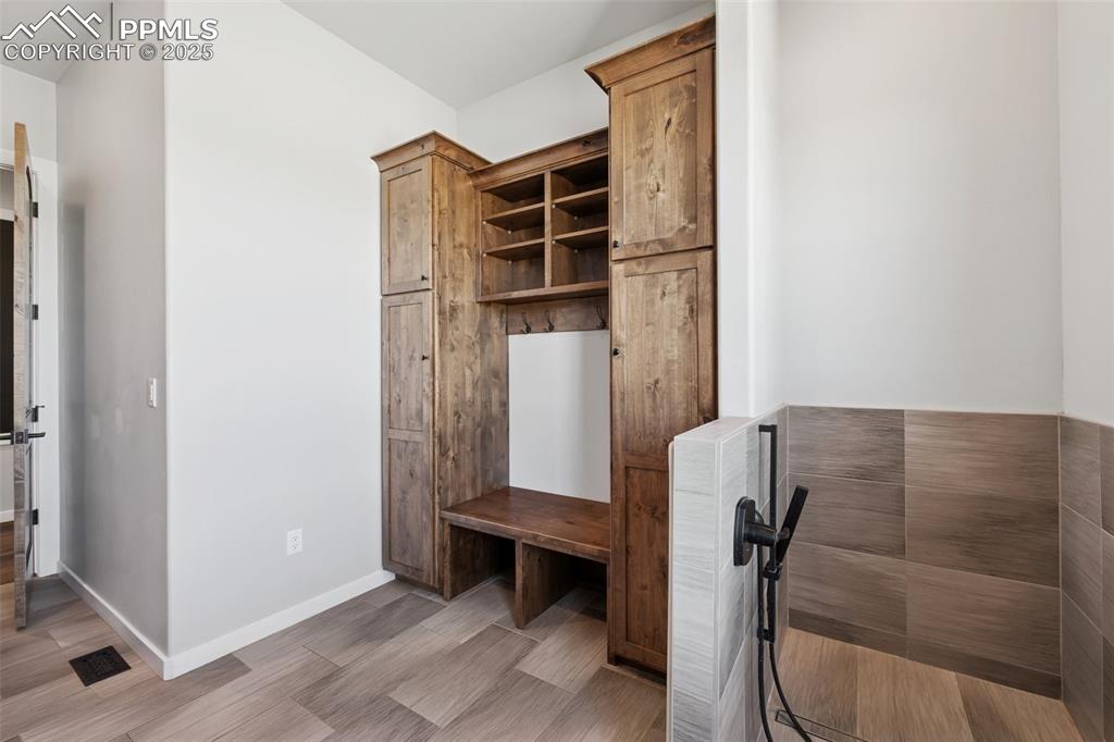 24365 Murphy Road Calhan, CO 80808 - Photo 32 of 48 Mudroom with light wood finished floors and baseboards