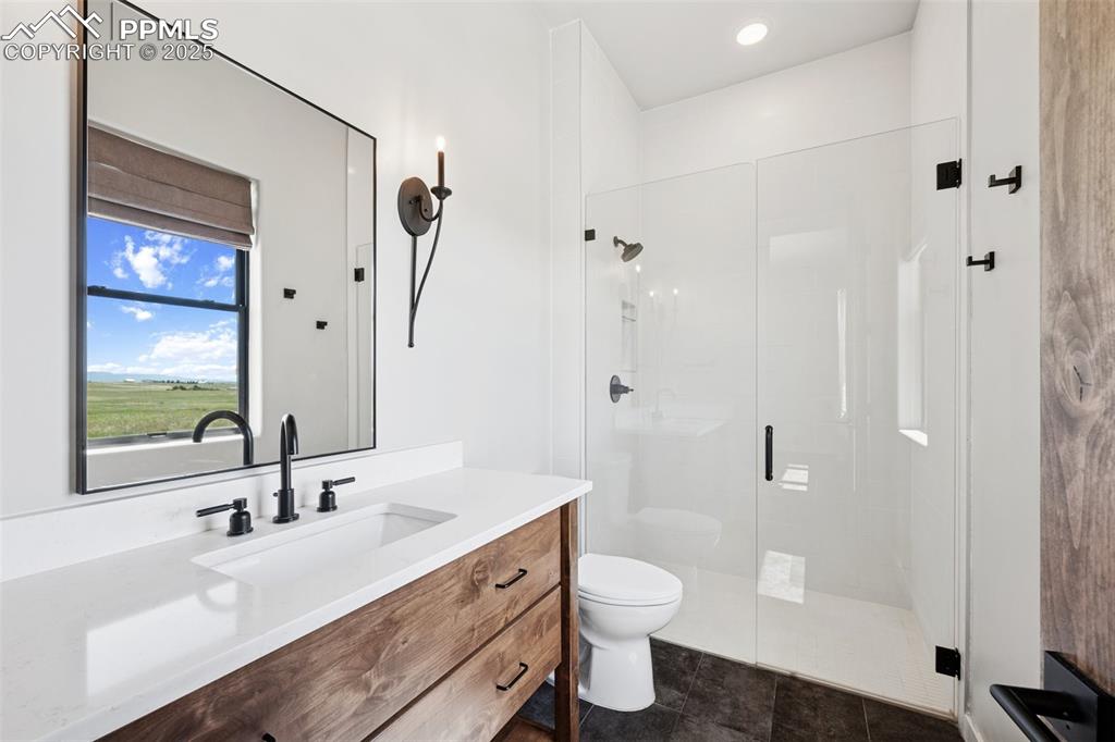 24365 Murphy Road Calhan, CO 80808 - Photo 35 of 48 a bathroom with a sink a toilet and shower