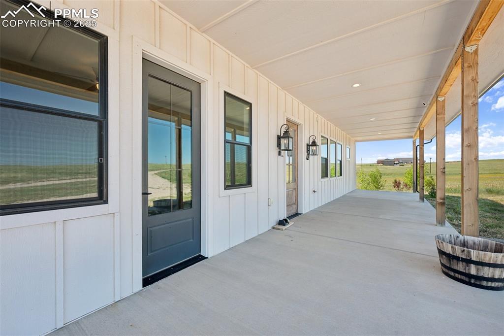 24365 Murphy Road Calhan, CO 80808 - Photo 47 of 48 a view of an entryway with wooden floor
