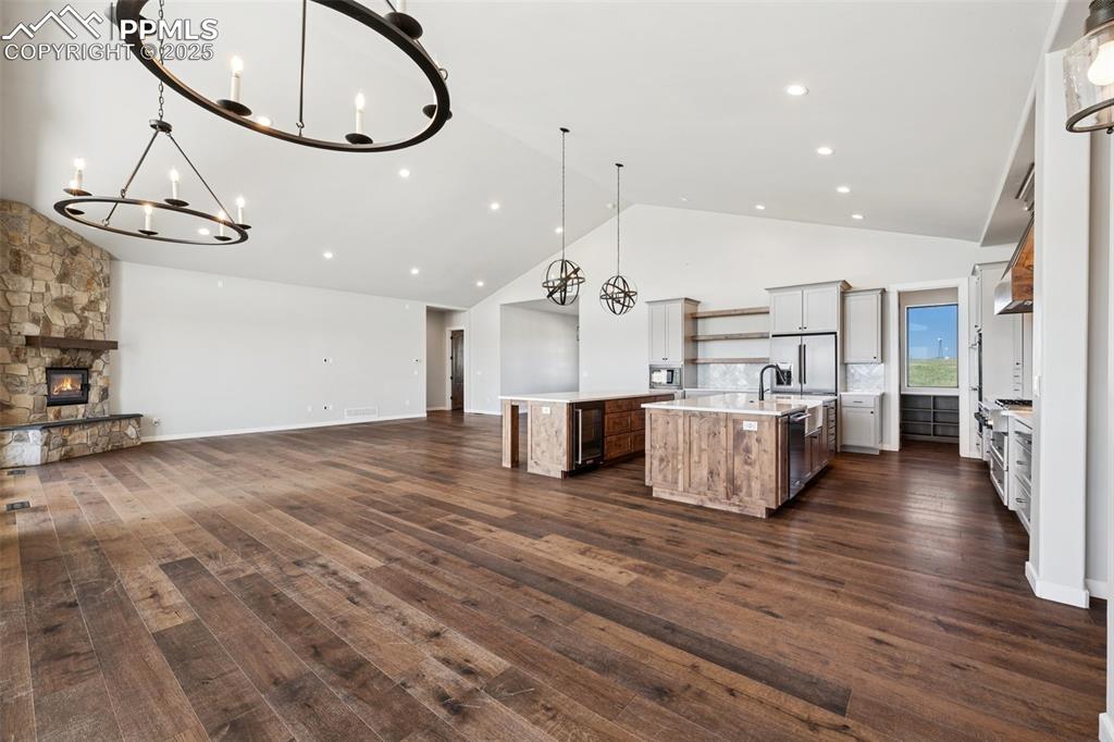 24365 Murphy Road Calhan, CO 80808 - Photo 10 of 48 a view of a kitchen with furniture and wooden floor