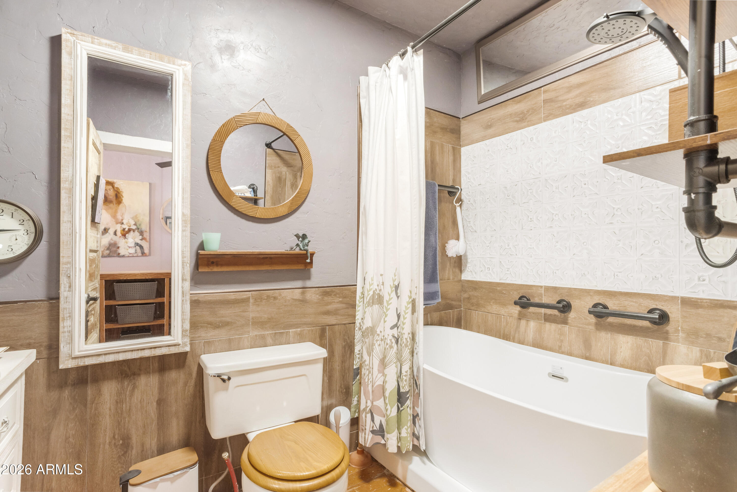 40 Main Street Bisbee, AZ 85603 - Photo 29 of 37 a bathroom with a toilet a sink and a bathtub