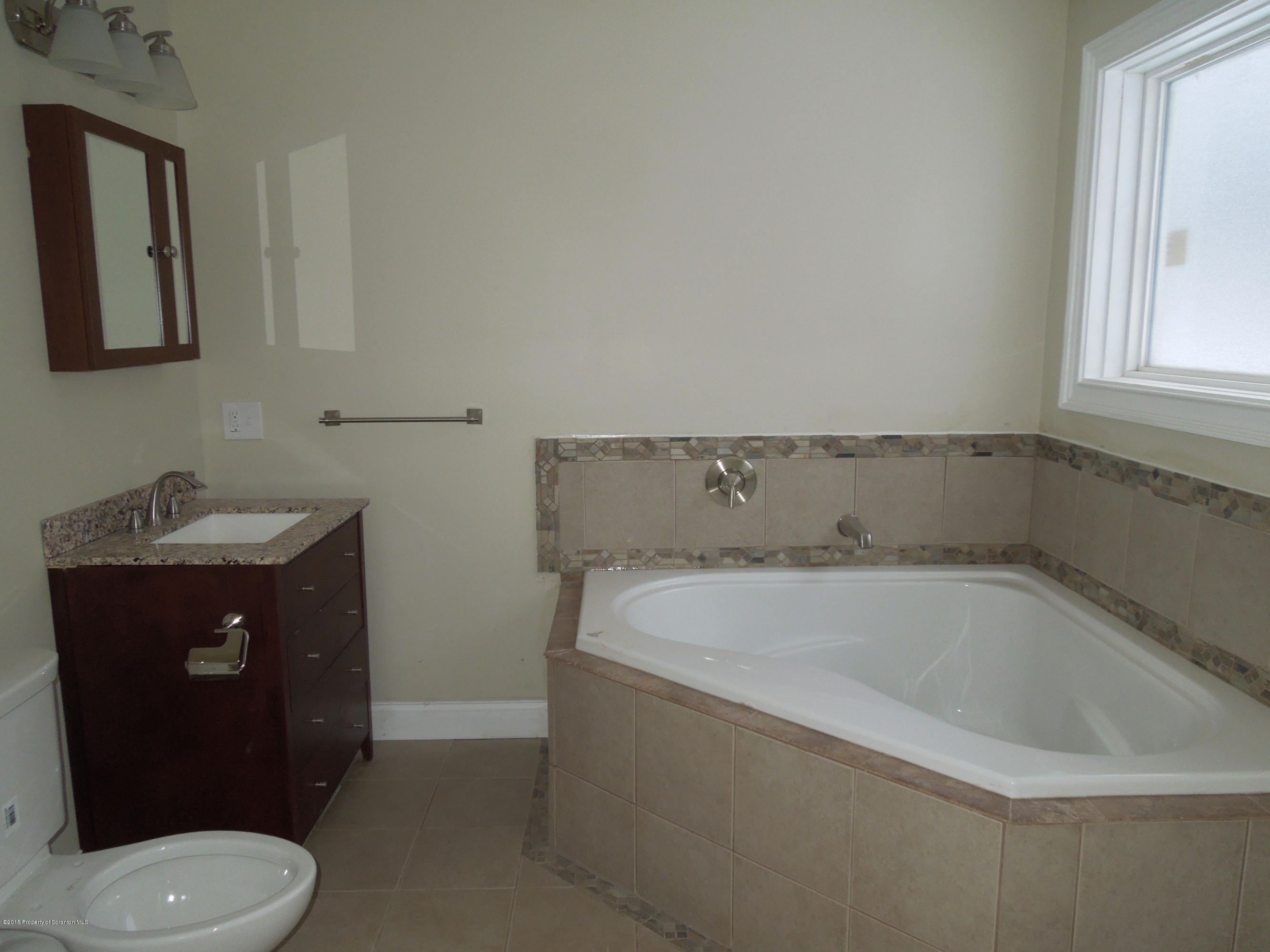 474 Fairview Road Dalton, PA 18414 - Photo 11 of 21 a bathroom with a sink toilet and mirror